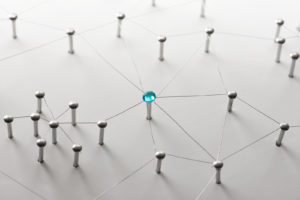Linking entities. Network, networking, social media, connectivity, internet communication abstract. Web of thin silver wires on white background. Key Person or network hub.